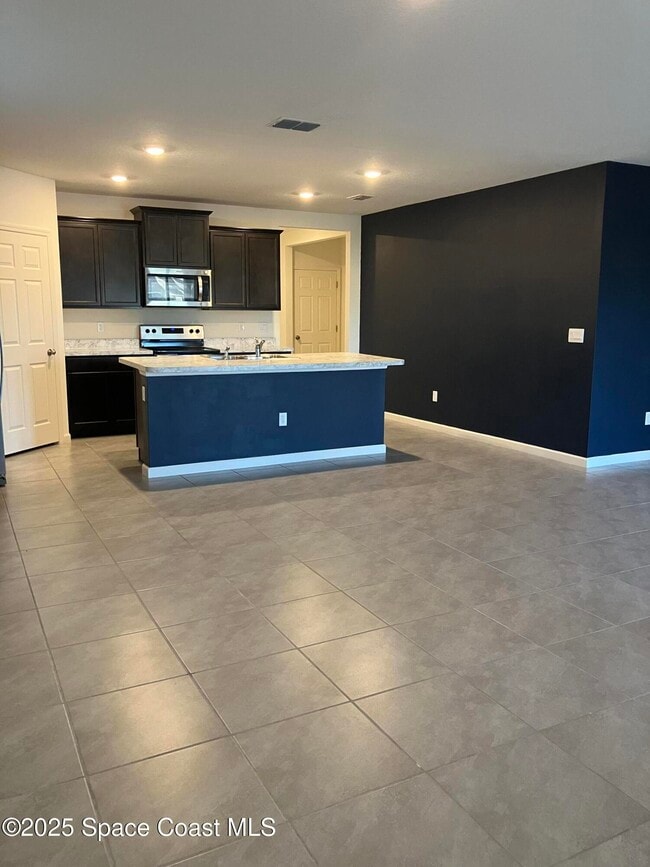 3469 Burrowing Owl Dr in Mims, FL - Building Photo - Building Photo