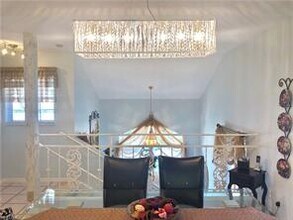 2460 Old Groves Rd-Unit -E-201 in Naples, FL - Foto de edificio - Building Photo