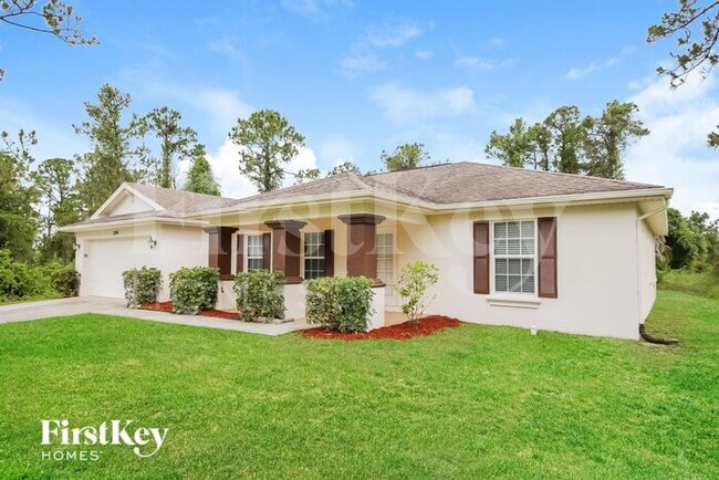 1056 Merry St E in Lehigh Acres, FL - Building Photo - Building Photo