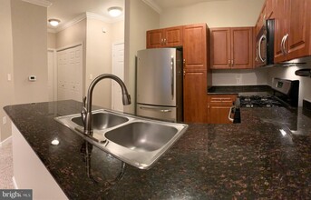 12917 Centre Park Cir-Unit -212 in Herndon, VA - Building Photo - Building Photo