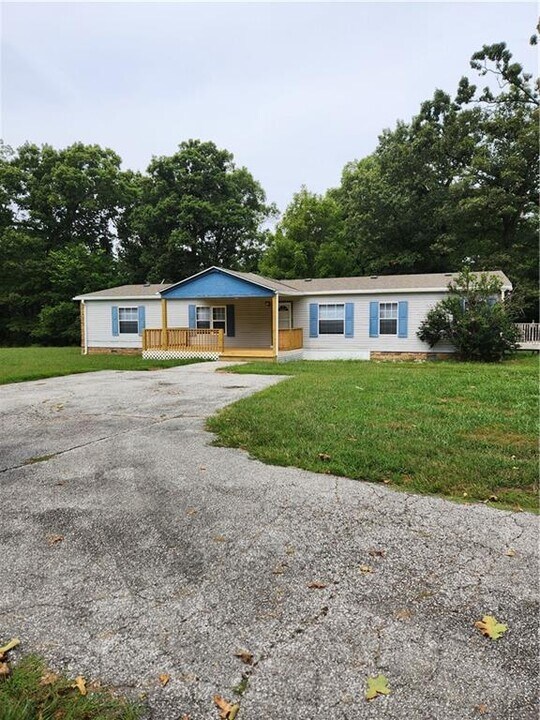 11959 Stage Coach Rd in Gravette, AR - Building Photo