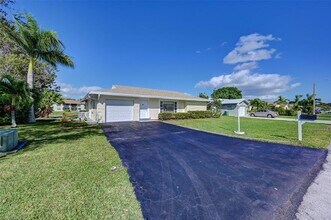 9807 NW 67th Ct in Tamarac, FL - Building Photo - Building Photo