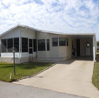 Whispering Pines Manufactured Home Community in Kissimmee, FL - Foto de edificio - Building Photo