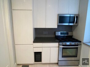 Stanton Street, Unit 4H in New York, NY - Building Photo - Building Photo