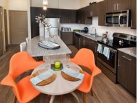Kitchen equipped with stainless steel appliances - Rialto Apartments in Orlando, Florida