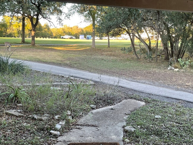 98 Woodcreek Dr in Wimberley, TX - Building Photo - Building Photo