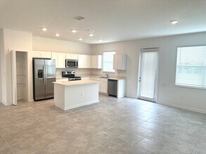 9042 MULLIGAN ISLAND Ln in Davenport, FL - Building Photo - Building Photo