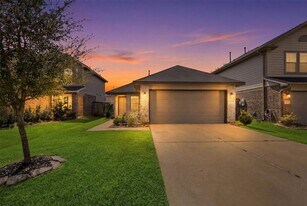 1223 Blue Hazel Ct in Pinehurst, TX - Building Photo