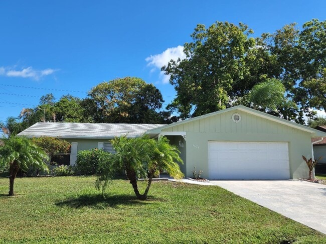 property at 1680 SE Minorca Ave