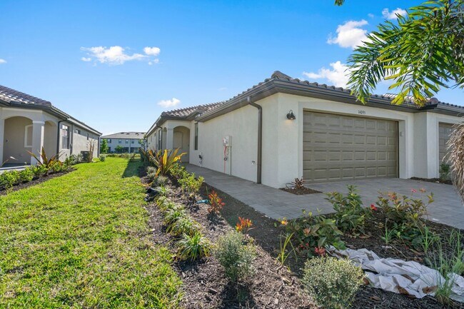 14107 Winding Cedar Wy in Miromar Lakes, FL - Building Photo - Building Photo