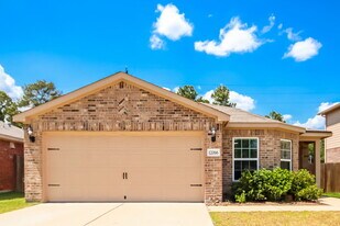 12066 Quartersawn Ln in Pinehurst, TX - Building Photo