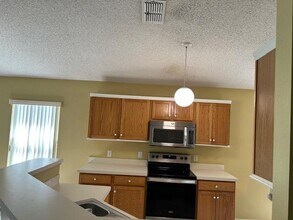 14121 Econ Woods Ln in Orlando, FL - Building Photo - Building Photo