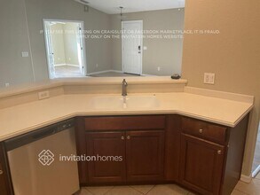 7699 Mclues Ave, Unit 1-208 in North Port, FL - Foto de edificio - Building Photo