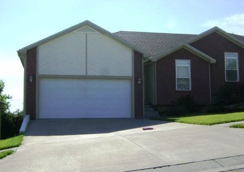 property at 1114 SW Red Oaks Ct