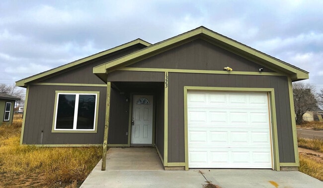 property at 1323 E 14th St