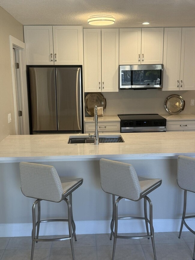 3957 NW Cinnamon Tree Cir in Jensen Beach, FL - Foto de edificio - Building Photo