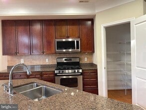 12313 Tanalian Falls Ln in Linton Hall, VA - Building Photo - Building Photo