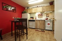1x1 Dining Area and Kitchen - The Standard Raintree Apartments in Tucson, Arizona