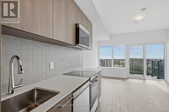 7439 Kingston Rd in Toronto, ON - Building Photo - Building Photo