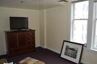 Living room w/ 39" Flat Screen - Extended Stay Apartments in Wheeling, West Virginia