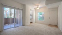 Carpeted Living Room with Balcony - Ridgewood Village Apartamentos in San Diego, California