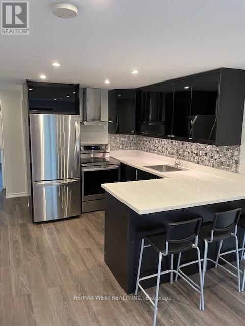property at 13-13 Sorauren Ave