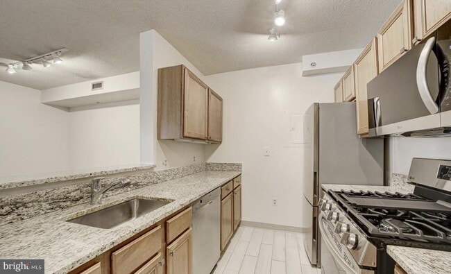 property at 7111 Woodmont Ave