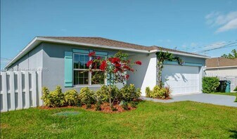 1522 SE Flintlock Rd in Port St. Lucie, FL - Building Photo