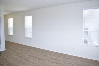 951 Pepperbark Loop in Mustang Ridge, TX - Building Photo - Building Photo