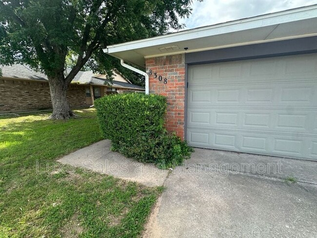 property at 8308 NW 8th St
