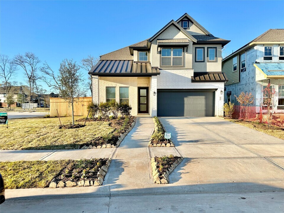 10603 Blossom River Dr in Sienna, TX - Building Photo