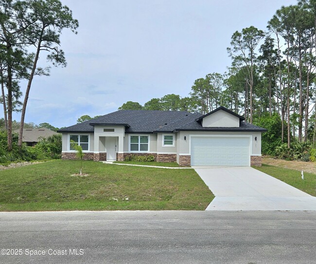 561 Harrisburg St SW in Palm Bay, FL - Building Photo - Building Photo