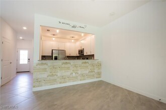 14103 Pine Lodge Ln in Miromar Lakes, FL - Building Photo - Building Photo