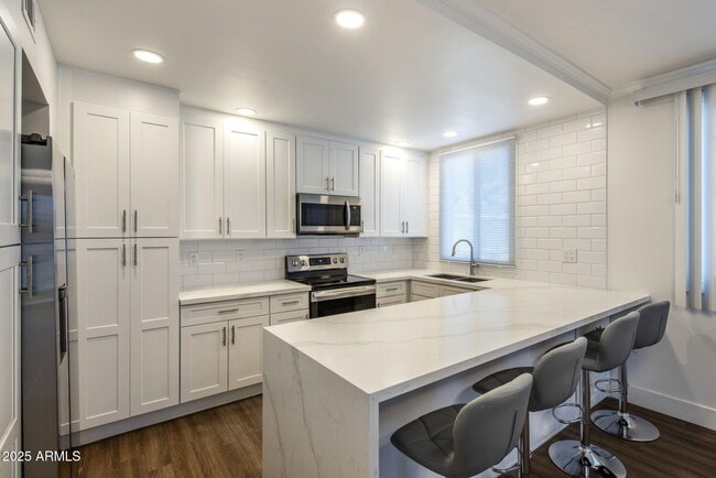 property at 6936 E 3rd St