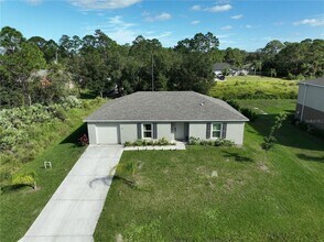 3251 Troutdale Ave in Palm Bay, FL - Foto de edificio - Building Photo