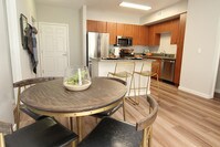 The gourmet kitchens feature granite counters and gas ranges - Dublin Station by Windsor Apartments in Dublin, California