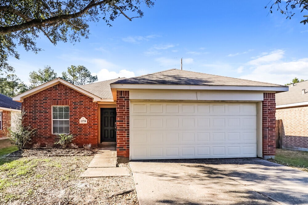 11738 Elizabeth Ct in Pinehurst, TX - Building Photo