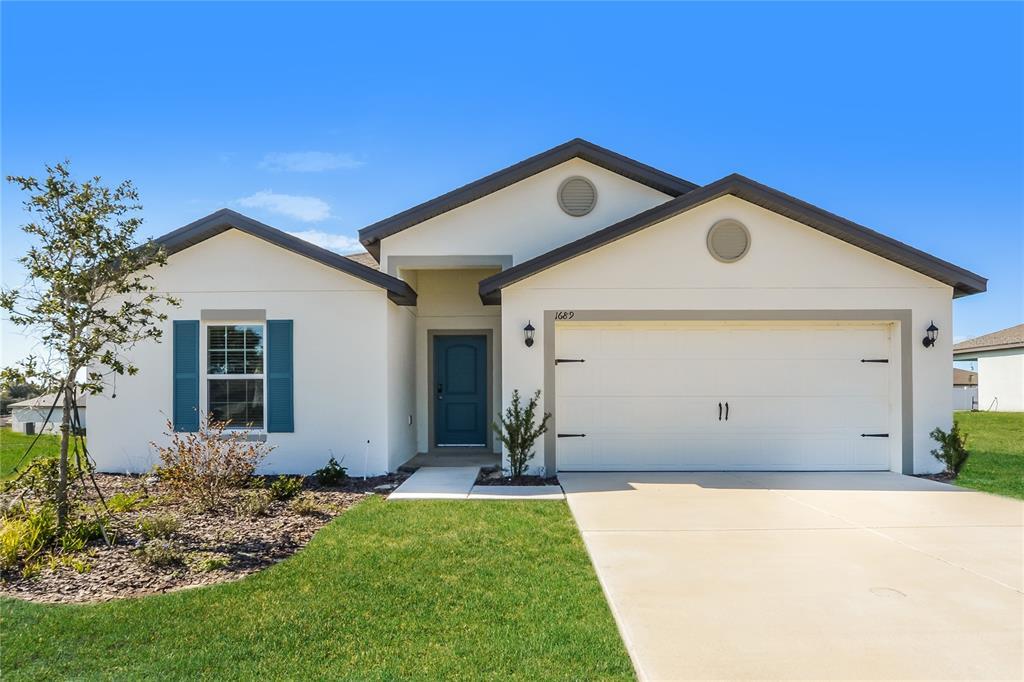 1689 Hideaway Flat St in Mascotte, FL - Building Photo