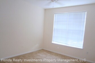 12825 Madison Pointe Cir-Unit -4-206 in Orlando, FL - Building Photo - Building Photo