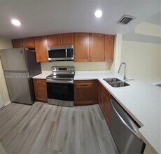 5051 Wiles Rd in Coconut Creek, FL - Building Photo - Building Photo