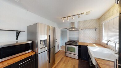 Bright & beautiful South Park Hill duplex property with large fenced shared yard in Denver, CO - Building Photo - Building Photo