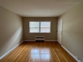 Cozy 1BR in Riverwest $895 – Heat Included | Hardwood Floors | Storage + Laundry in Milwaukee, WI - Building Photo - Interior Photo