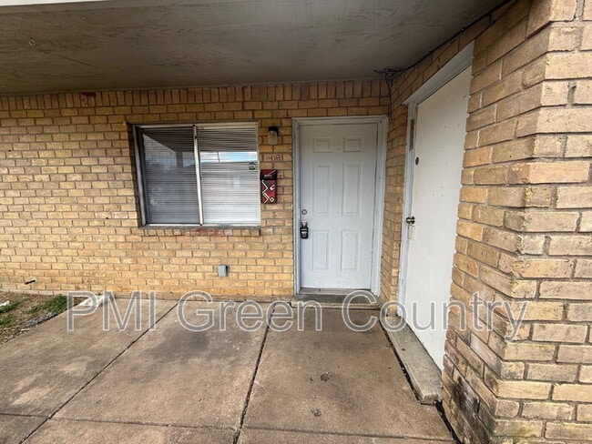 property at 1418 S 73rd E Ave