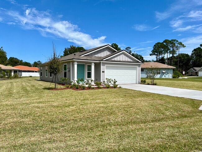 56 Pilgrim Dr in Palm Coast, FL - Foto de edificio - Building Photo