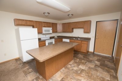 Alumni Suites in Minot, ND - Building Photo - Building Photo