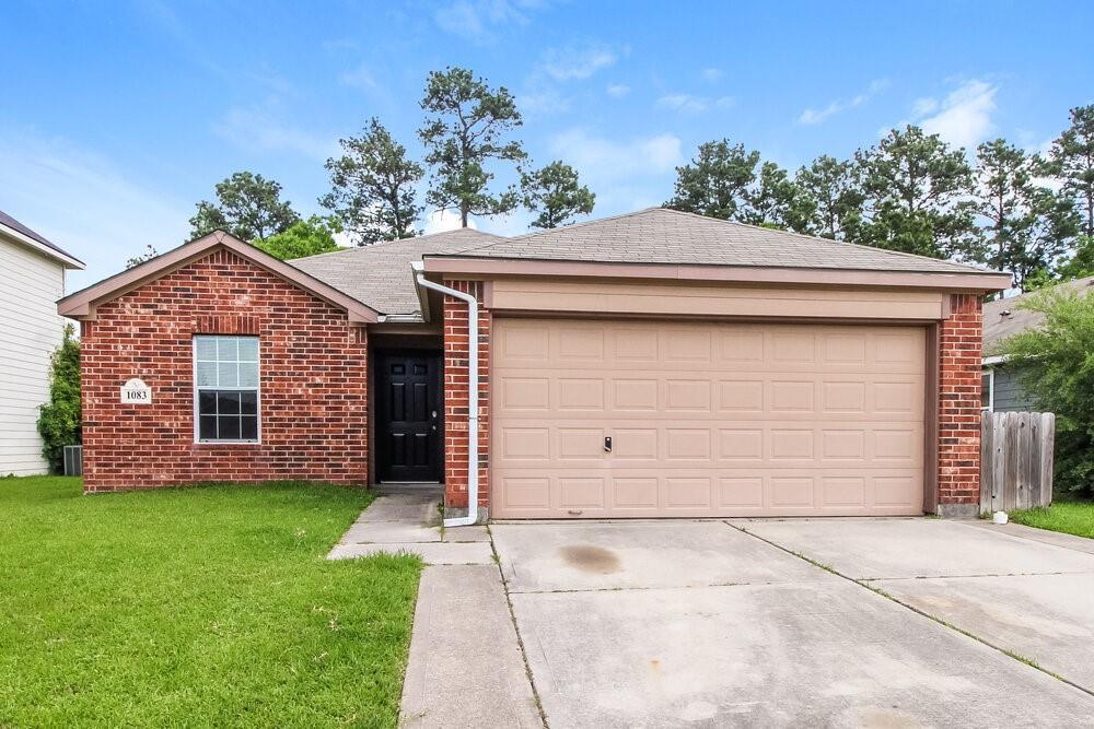 1083 Shadow Glenn Dr in Conroe, TX - Building Photo