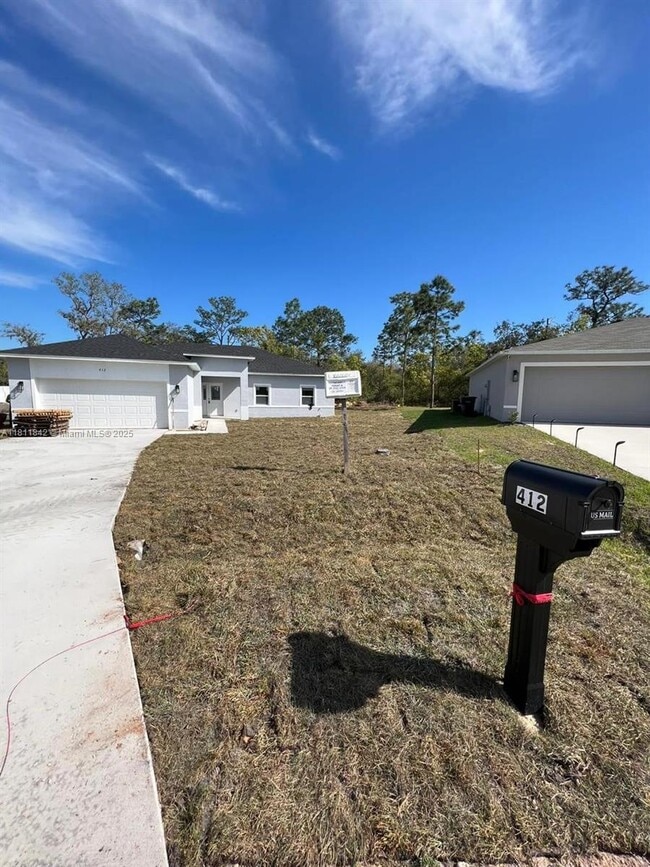 412 Oakland Ln in Poinciana, FL - Building Photo - Building Photo