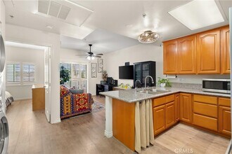 17888 Alburtis Ave, Unit A202 in Artesia, CA - Building Photo - Building Photo