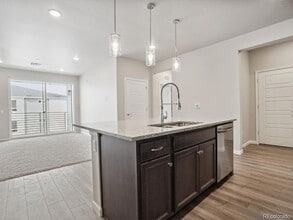 6153 N Ceylon St, Unit 10-303 in Denver, CO - Building Photo - Building Photo