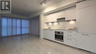 33 Frederick Todd Wy, Unit 402 in Toronto, ON - Building Photo